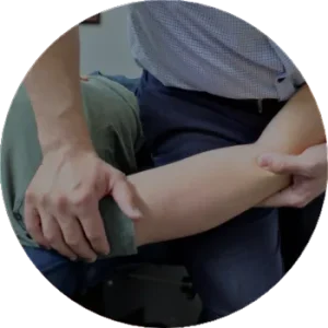 Chiropractor adjusting an extremity at ICE